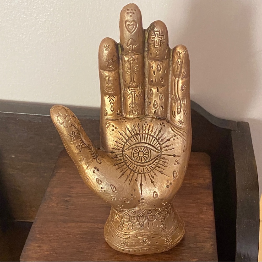 Decorative gold evil eye hamsa hand shaped Halloween witchy decoration sculpture